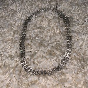 Silver color choker necklace.